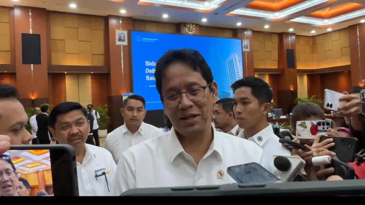 Menteri Keuangan (Menkeu) Purbaya Yudhi Sadewa usai Sidang Terbuka Satgas Debottlenecking, Senin (26/1/2026). (Liputan6.com/Gagas)