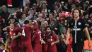 Pemain Liverpool merayakan gol James Milner ke gawang Paris Saint-Germain (PSG) saat bertanding di Liga Champions di Anfield, Liverpool, Inggris, Selasa (18/9). Liverpool membungkam PSG 3-2. (Paul ELLIS/AFP)