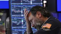 Wall Street Beragam Usai The Fed Tahan Suku Bunga