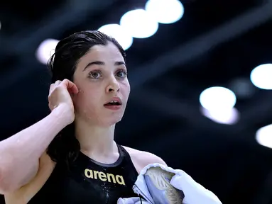 Yusra Mardini merupakan seorang atlet renang putri kategori 100 meter gaya bebas dan gaya kupu-kupu pada Olimpiade Tokyo 2020. Ia merupakan warga Suriah yang saat ini tinggal di Hamburg, Jerman dengan status pengungsi. (Foto: AFP/Ronny Hartmann)