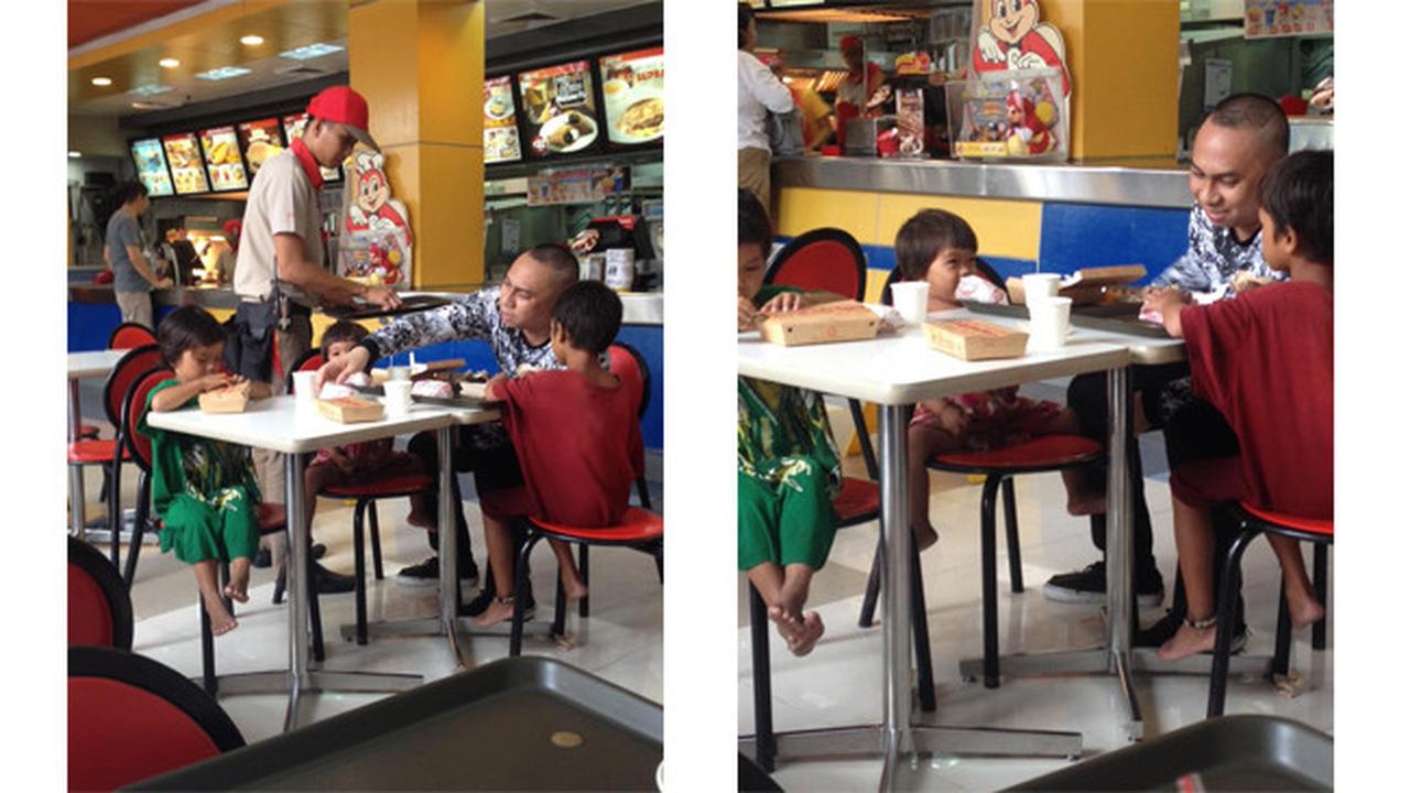 Seorang Pria Memberi Makan Anak Jalanan