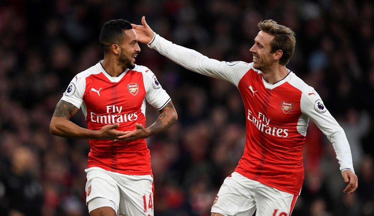 Pemain Arsenal, Theo Walcott, merayakan golnya ke gawang AFC Bournemouth dalam laga pekan ke-13 Premier League 2016-2017 di Stadion Emirates, Minggu (27/11/2016). (Action Images via Reuters/Tony O'Brien)