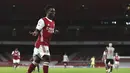 Gelandang Arsenal, Bukayo Saka berselebrasi usai mencetak gol ke gawang Newcastle United pada pertandingan Liga Inggris di Stadion Emirates di London, Selasa (19/1/2021). (Catherine Ivill/Pool via AP)