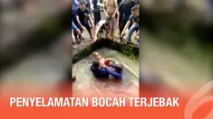 Detik-detik petugas damkar menyelamatkan seorang bocah yang jatuh dan terjebak di saluran air.