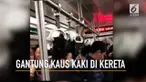 Rekaman seorang pria dengan santai menggantung kaus kaki di kereta.