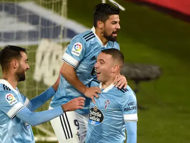Penyerang Celta Vigo, Iago Aspas, merayakan gol yang dicetaknya ke gawang Cadiz pada laga lanjutan Liga Spanyol di Stadion Abanca Balaidos, Selasa (15/12/2020) dini hari WIB. Celta Vigo menang telak 4-0 atas Cadiz. (AFP/Miguel Riopa)