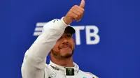 Pembalap Mercedes, Lewis Hamilton, menjuarai GP Rusia Formula 1 di Sirkuit Sochi Autodrom, Sochi, Minggu (30/9/2018). (AFP/Andrej Isakovic)