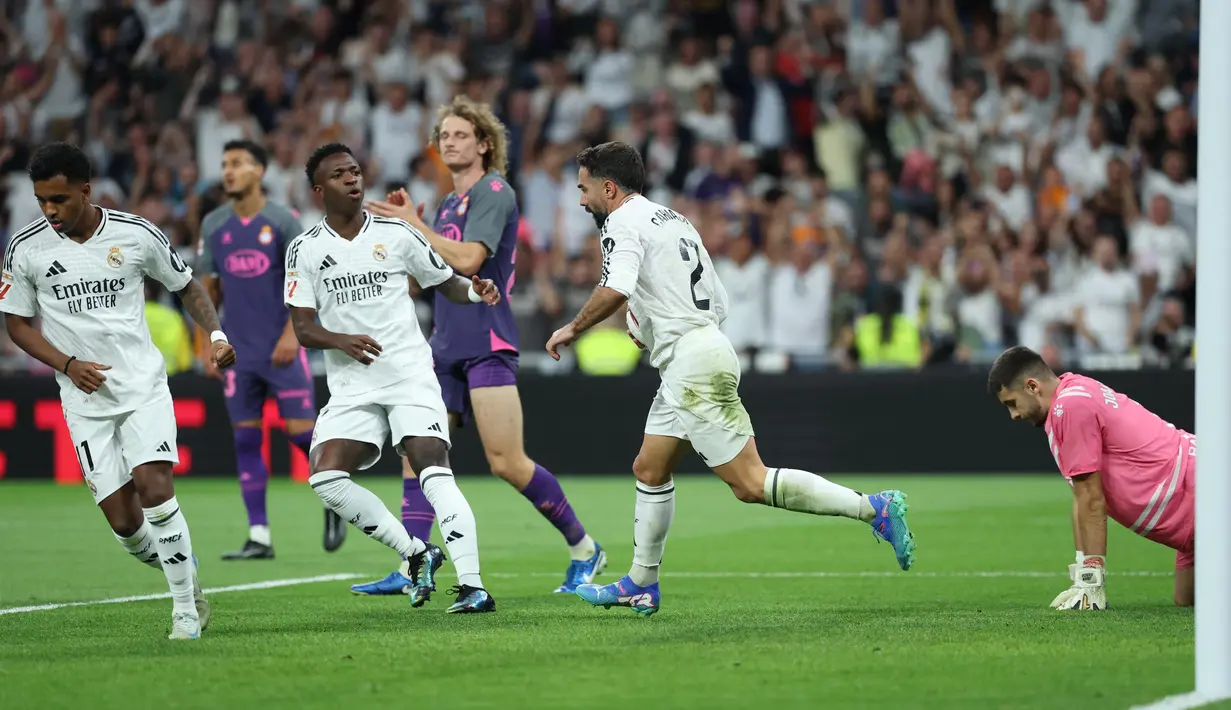 Sempat tertinggal lebih dulu, Los Blancos berhasil menyamakan skor lewat gol Dani Carvajal pada menit ke-58. (Thomas COEX/AFP)