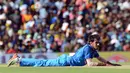 Pemain kriket India Yuzvendra Chahal berada di lapangan setelah mencoba memasukkan bola saat pertandingan kriket One Day International (ODI) pertama antara Sri Lanka dan India di Dambulla (20/8). (AFP Photo/Lakruwan Wanniarachchi)