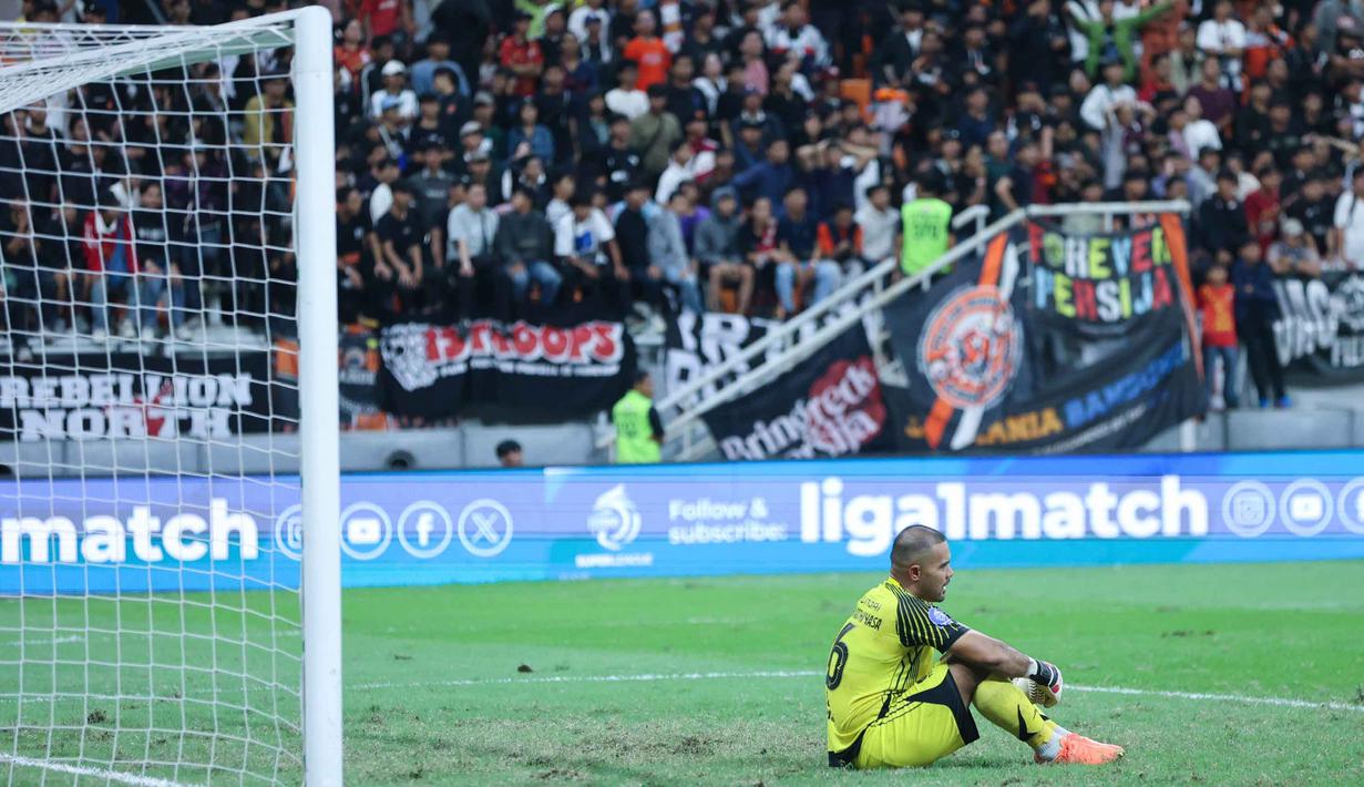 Hasil imbang ini membuat Persija tetap berada di posisi kedua dengan 51 poin. Tampa dalam foto, ekspresi penjaga gawang Persija, Andritany Ardhiyasa usai bertanding melawan Borneo FC pada laga pekan ke-24 BRI Super League 2025/2026 di Jakarta International Stadium, Selasa (3/3/2026) malam WIB. (Bola.com/M Iqbal Ichsan)