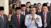 Menteri Dalam Negeri (Mendagri) Tito Karnavian saat menjelaskan soal empat dari sembilan Pj Gubernur yang dilantik berasal dari TNI-Polri. (Liputan6.com/Nanda Perdana Putra)