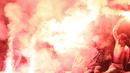 Suporter PSS Sleman menyalakan flare saat melawan Semen Padang pada laga Liga 2 di Stadion Pakansari, Jawa Barat, Selasa (4/12). PSS menang 2-0 atas Semen Padang. (Bola.com/M. Iqbal Ichsan)