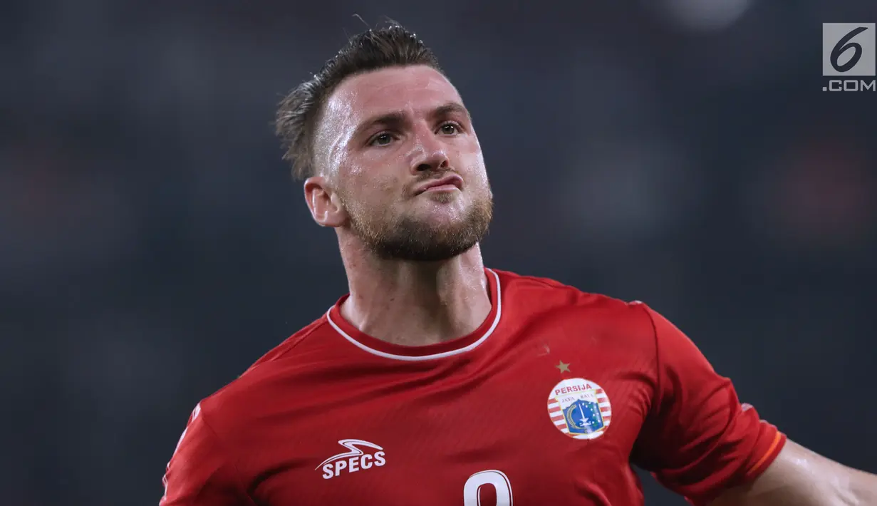 Ekspresi pemain Persija, Marko Simic saat merayakan gol ke gawang Johor Darul Takzim pada lanjutan penyisihan Grup H Piala Asia 2018 di Stadion GBK, Jakarta, Selasa (10/4). Persija menang telak 4-0. (Liputan6.com/Helmi Fithriansyah)