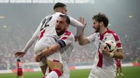 Selebrasi para pemain Timnas Georgia merayakan gol penyeimbang 1-1 ke gawang Timnas Turki yang dicetak Georges Mikautadze (kiri) pada laga matchday pertama Grup F Euro 2024 di Westfalenstadion, Dortmund, Jerman, Selasa (18/6/2024). (AP Photo/Alessandra Tarantino)