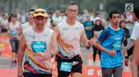 Ekspresi sejumlah pelari saat mencapai garis finis Jakarta Marathon 2018 di Gelora Bung Karno, Jakarta, Minggu (28/10). 12.500 pelari meramaikan Jakarta Marathon 2018 yang di sponsori PLN. (Liputan6.com/Faizal Fanani)