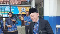 Sekretaris Dinas Pendidikan Kota Depok, Sutarno usai mengikuti kegiatan di SMPN 22 Depok. (Liputan6.com/Dicky Agung Prihanto)