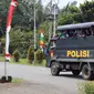 Truk TNI/Polri dikerahkan untuk membantu mengevakuasi atau mengantar pulang 1.000-an orang massa aksi demo yang sejak semalam menduduki kantor Gubernur Papua. (Liputan6.com/Katharina Janur)