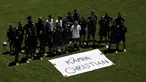 Tim Swedia berpose di sebelah tanda bertuliskan "Get Well Christian" untuk gelandang Denmark Christian Eriksen selama sesi latihan di stadion La Cartuja di Seville, Spanyol, Minggu (13/6/2021). Swedia akan bertanding melawan Spanyol pada Grup E Euro 2020. (Julio Munoz/Pool via AP)