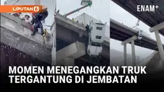 Badai musim dingin menyebabkan kecelakaan di West Virginia, AS, saat sebuah truk tergantung di tepi jembatan. Pengemudi berhasil diselamatkan tanpa cedera.
