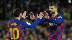 Gerard Pique pernah bermain satu tim bersama Lionel Messi saat di Barcelona. Jauh sebelumnya Pique merupakan rekan Cristiano Ronaldo ketika dirinya membela Manchester United sebelum hengkang 2008 silam. (Foto: AFP/Lluis Gene)