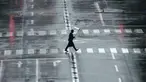 Seorang pria berjalan di tengah hujan yang dibawa oleh Topan Mindulle di Tokyo, Jepang, Jumat (1/10/2021). Topan Mindulle sedang bergerak di lepas pantai Jepang. (AP Photo/Eugene Hoshiko)