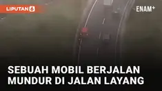 Aksi sebuah mobil berjalan mundur di jalan layang mengundang perhatian