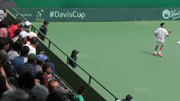 Ekspresi David Agung Susanto saat meraih angka melawan petenis Filipina pada Piala Davis 2018 grup dua Asia/Oceania di Senayan, Jakarta, Sabtu (4/2/2018). Alberto menang 6-3, 6-4. (Bola.com/Nick Hanoatubun)