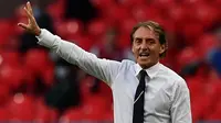 Pelatih Italia, Roberto Mancini menunjukkan gestur ketika pertandingan 16 besar Euro 2020 antara Italia melawan Austria yang berlangsung di Stadion Wembley, London, Inggris pada Sabtu (26/06/2021). (AFP/Pool/Ben Stansall)