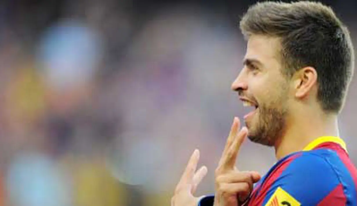 Kegembiraan defender Barcelona Gerard Pique seusai menjebol gawang Espanyol dalam lanjutan La Liga yang digelar di Nou Camp Stadium, 8 Mei 2011. Barca unggul 2-0. AFP PHOTO / LLUIS GENE
