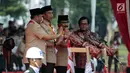 Presiden Joko Widodo saat membuka acara Peringatan Hari Pramuka dan Pembukaan Raimuna Nasional XI Gerakan Pramuka di Bumi Perkemahan Cibubur, Jakarta, Senin (13/8). (Liputan6.com/Faizal Fanani)