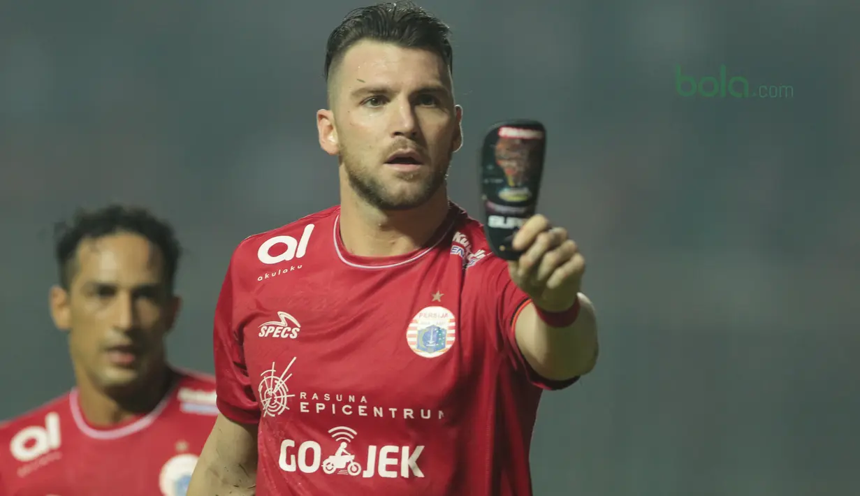 Pemain Persija Jakarta, Marko Simic merayakan golnya ke gawang Persipura Jayapura pada lanjutan Liga 1 Gojek bersama Bukalapak di Stadion Pakansari, Bogor, (25/5/2018).  (Bola.com/Nick Hanoatubun)