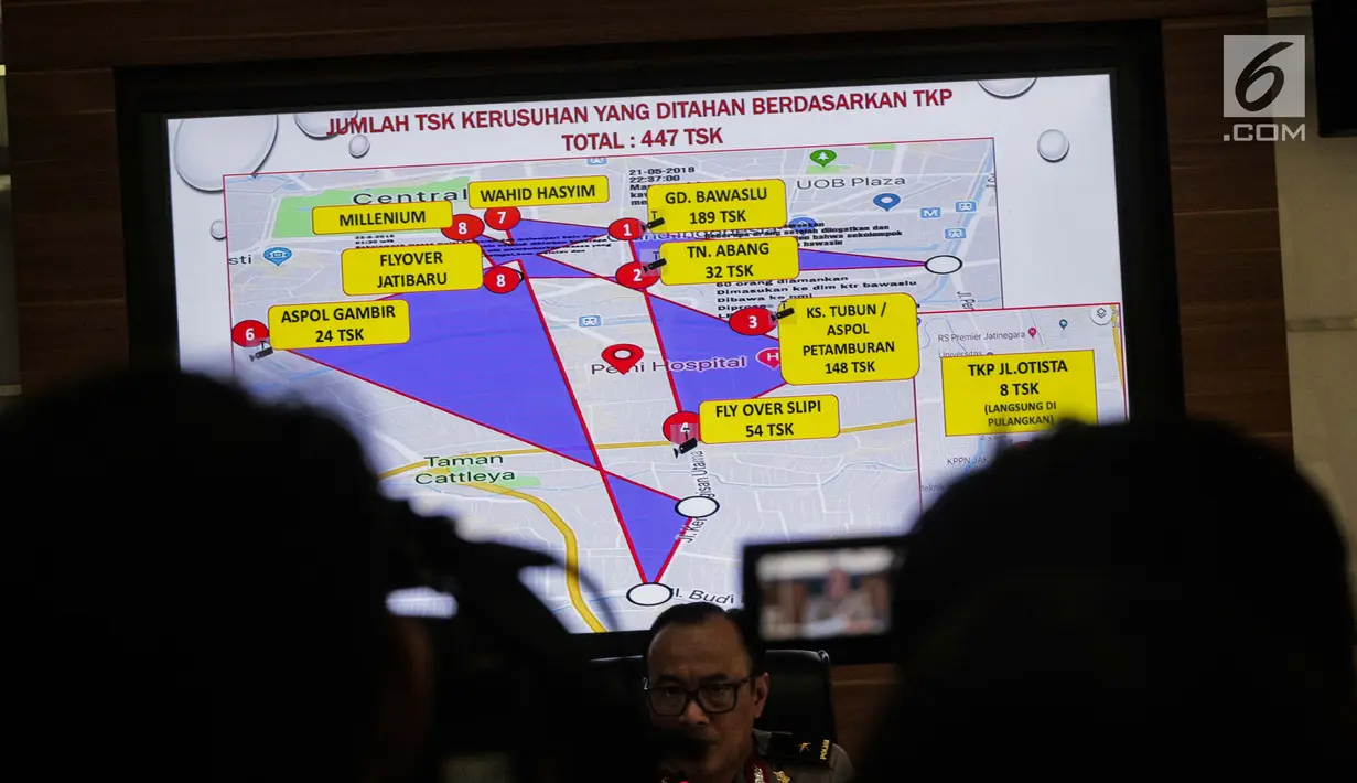 Layar monitor memperlihatkan jumlah tersangka yang ditahan berdasarkan Tempat Kejadian Perkara (TKP) saat rilis perkembangan hasil penyidikan perkara kerusuhan 21-22 Mei di Mabes Polri, Jakarta Selatan, Jumat (5/7/2019). (Liputan6.com/Faizal Fanani)