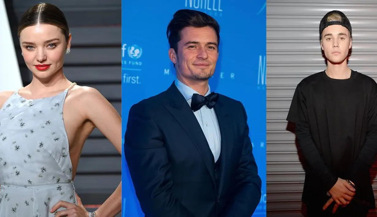 Orlando Bloom memukul Justin Bieber saat pelantun lagu "Sorry" tersebut menggoda mantan istrinya Miranda Kerr usai Victoria's Secret Fashion Show di tahun 2012. (Getty Images/Cosmopolitan)