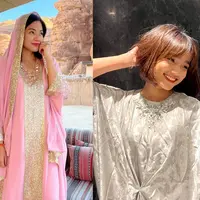 Nina Zatulini memilih kaftan pink pastel dengan motif minimalis yang memberi kesan anggun. Kaftan tersebut dipadukan dengan kulot warna putih. [@ninazatulini22]