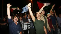 Kekejaman militer Israel yang menyebom Gaza dan menyebabkan ratusan jiwa melayang membuat mereka marah, Ankara, Turki, Jumat (18/7/2014) (AFP PHOTO/ADEM ALTAN)