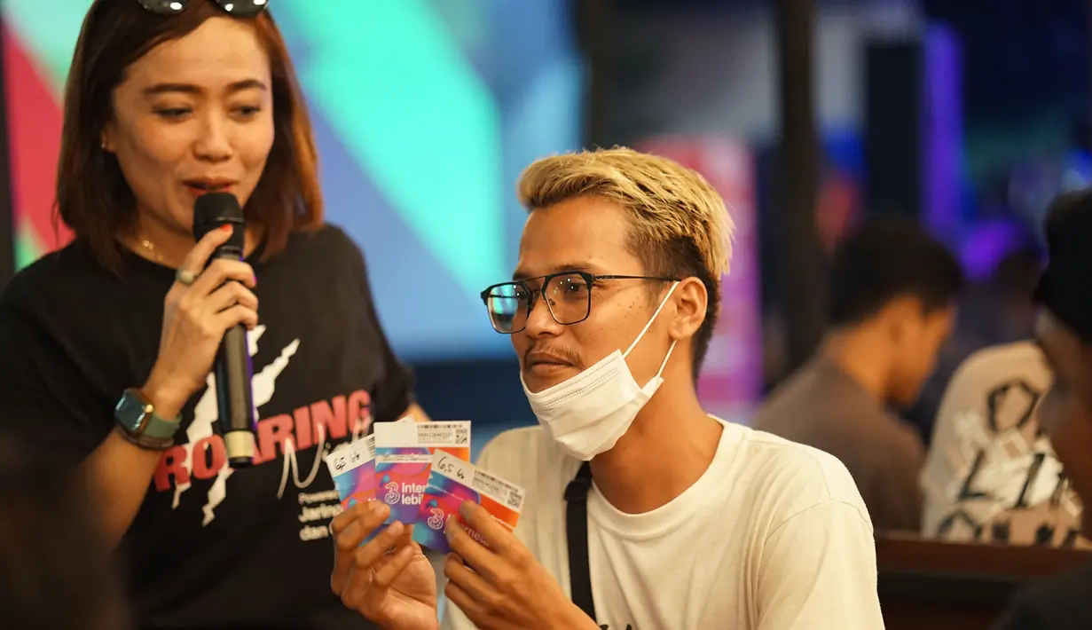 Tak hanya live music, para peserta nonton bareng juga dapat bermain games dan kuis persembahan dari Tri, jaringan hemat dan cepat. (Istimewa)