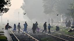 Otoritas kota terbesar kedua di Pakistan, Lahore, pada Minggu (3/11/2024) mengumumkan menutup sementara aktivitas sekolah dasar selama sepekan karena polusi yang mencapai rekor. (Arif ALI/AFP)