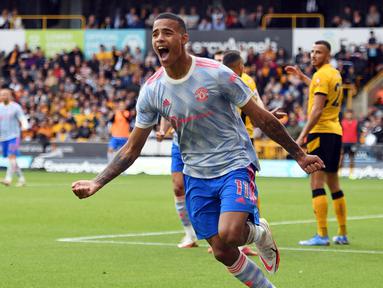Manchester United sukses membawa poin tiga di pekan ketiga Liga Inggris 2021/2022, dari lawatannya ke markas Wolverhampton. Skuat asuhan Solskjaer tersebut memenangkan laga dengan skor tipis 1-0. (Foto: AFP/ Oli Scarff)