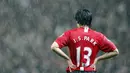 Park Ji Sung mengenakan nomor punggung 13 selama tujuh tahun berkarier di Manchester United. Ia mencatatkan 28 gol dan 29 assist dari 204 penampilan bersama The Red Devils di semua kompetisi. (AFP/Paul Ellis)