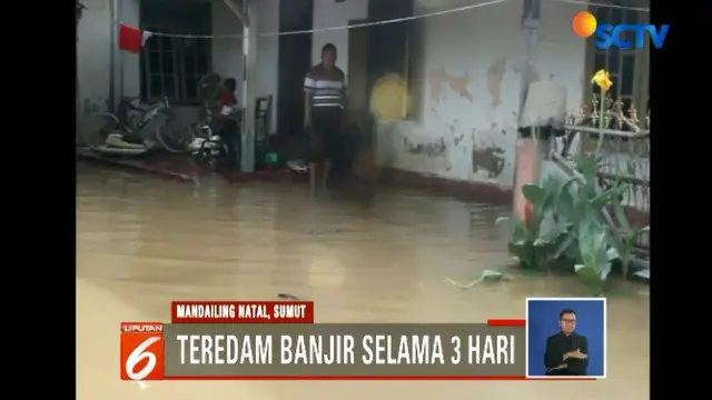 Banjir sudah merendam kawasan ini selama tiga hari. Hingga kini, warga belum menerima banyak bantuan dari pemerintah.