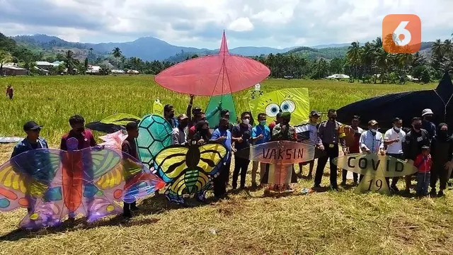 Layangan Covid-19 dan Vaksin Menghiasi Langit Gorontalo (Arfandi Ibrahim/Liputan6.com)
