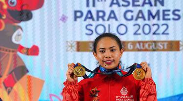 Lifter andalan Indonesia Widiasih Ni Nengah sukses memenuhi ekspetasinya dengan merebut dua medali emas di cabang kelas berat 45 kg putri ASEAN Para Games (APG) 2022 di Hotel Solo Paragon, Senin (1/8/2022). (FOTO: Dok. ASEAN Para Sports Federation)