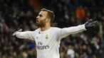 Striker Real Madrid, Jese Rodriguez, melakukan selebrasi usai mencetak gol ke gawang Sevilla pada laga La Liga di Stadion Santiago Bernabeu, Minggu (20/3/2016). Jese resmi meninggalkan PSG dan bergabung ke Stoke City. (AFP/Pierre-Philippe Marcou)