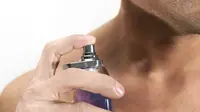 Man Sprays Perfume