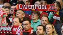 Suporter Liverpool memberikan dukungan kepada timnya pada laga Merseyside Derby melawan Everton di Stadion Anfield, Liverpool, Kamis (21/4/2016) dini hari WIB. (AFP/Paul Ellis)