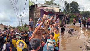 Tangkapan layar rekaman video viral warga gelar aksi tebar lele di jalan berlubang sebagai ungkapan protes kepada pemerintah Lampung Selatan (Istimewa)
