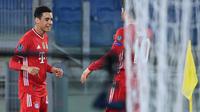 Pemain muda Bayern Munchen, Jamal Musiala ketika mencetak gol ke gawang Lazio pada leg 1 babak 16 besar Liga Champions 2020/2021, Rabu dini hari WIB. (Alberto PIZZOLI / AFP)