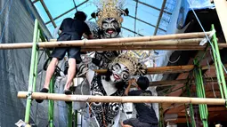 Ogoh-ogoh merupakan karya seni patung dalam kebudayaan Bali yang menggambarkan kepribadian Bhuta Kala. (SONNY TUMBELAKA/AFP)