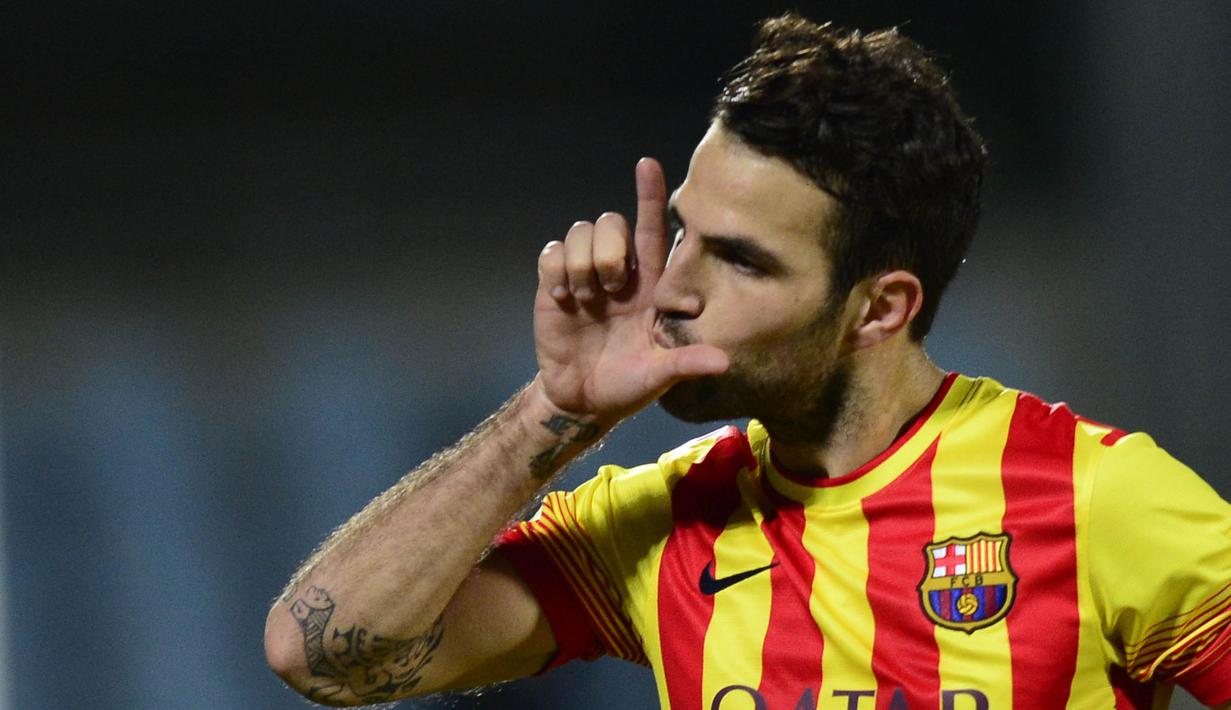 Cesc Fabregas - Gelandang berusia 34 tahun ini hadir di Camp Nou saat Guardiola melakoni musim terakhir dan berhasil memborong empat gelar. Namun pada 2014  pemain yang saat ini memperkuat AS Monaco menerima pinangan Mourinho untuk memperkuat Chelsea. (AFP/Javier Soriano)