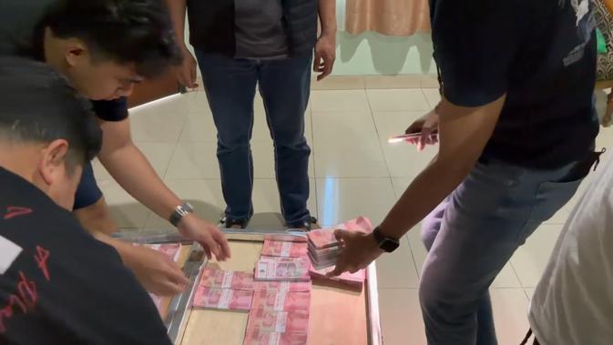 Membongkar Produksi Uang Palsu Pecahan Rp 100 Ribu di Dalam Kamar Hotel di Bogor